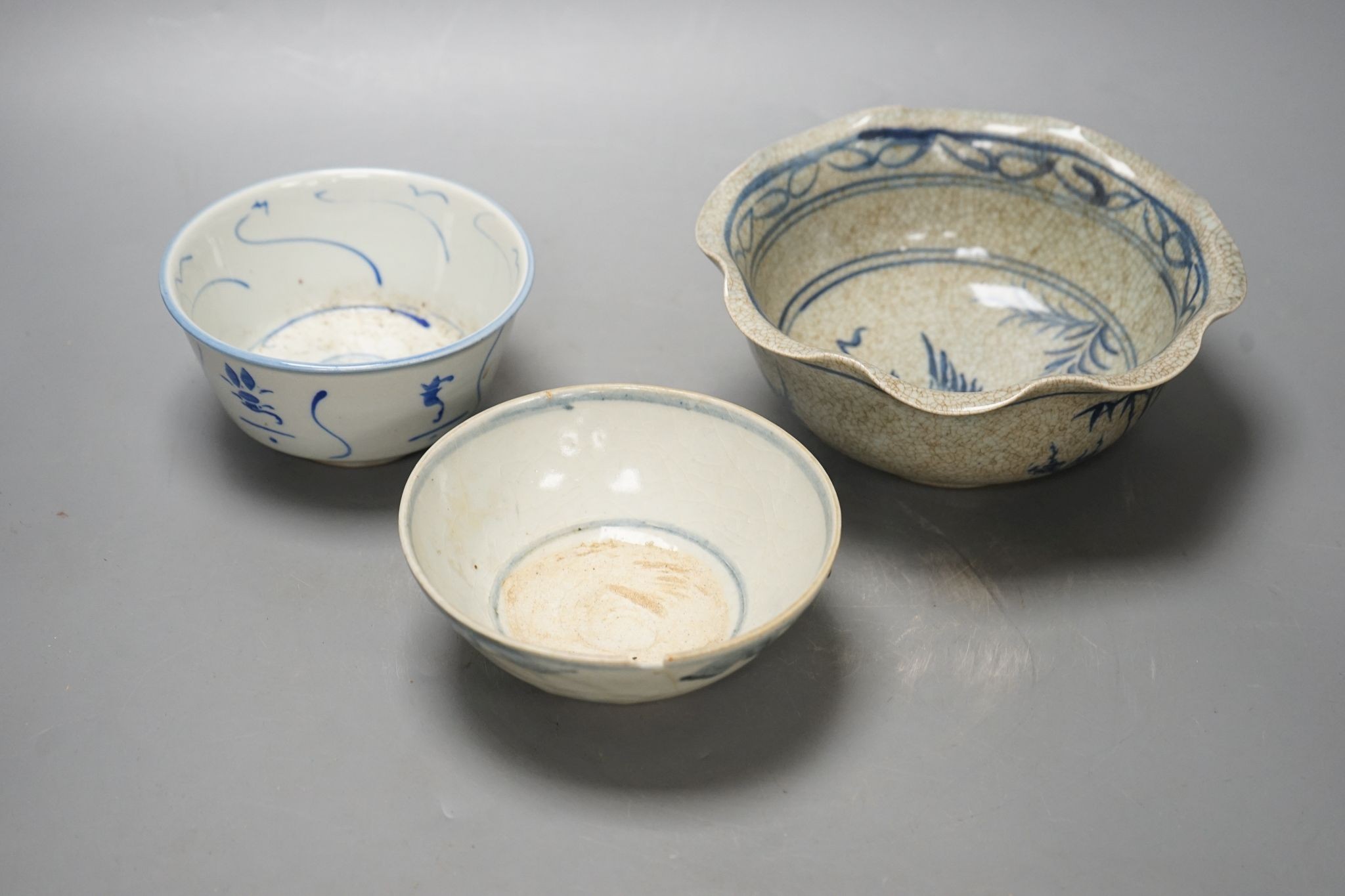 Three Chinese porcelain blue and white bowls, largest 17cm. diam.